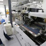 Caitlin Cramer, a PhD student in materials science engineering, demonstrates a machine that can print electrical circuits and solar cells at the newly opened Washington Clean Energy Testbeds lab.