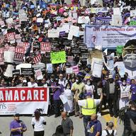 Hundreds of people march through downtown Los Angeles protesting President Donald Trump's plan to dismantle the Affordable Care Act, his predecessor's signature health care law, in March, 2017.