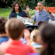 President Barack Obama and first lady Michelle Obama act out monsters as they read 'Where the Wild Things Are,' to children at the White House Easter Egg Roll on the South lawn at the White House.