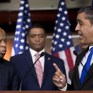 Rep. Adriano Espaillat, D-N.Y., right, accompanied by Civil Rights activist Rep. John Lewis, D-Ga., left, and Congressional Black Caucus Chairman Rep. Cedric Richmond, D-La., center.