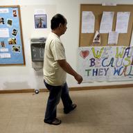 Arthur Jemmy walks through a hallway at The Reformed Church of Highland Park, where he and his wife are taking sanctuary to avoid deportation, Thursday, Oct. 12, 2017, in Highland Park, N.J.
