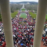 Teachers from across Kentucky gather outside the state Capitol to rally for increased funding and to protest changes to their state funded pension system, Monday, April 2, 2018, in Frankfort, Ky.