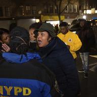 Sandy Michelin, an aunt of Kimani Gray, who was fatally shot by police in 2013, shouts at officers after police shot and killed a man in the Crown Heights neighborhood of Brooklyn, Wednesday, 4/4/18.