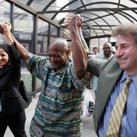 Larry Fuller, center, with Innocence Project lawyers Barry Scheck, right, and Vanessa Potkin, after DNA evidence exonerated him. 