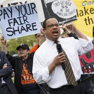 Rep. Keith Ellison, D-Minn. joins low-wage workers at a rally outside the Capitol in Washington, Monday, April 28, 2014, to urge Congress to raise the minimum wage as lawmakers return to Washington.