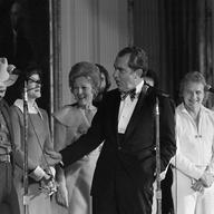 Country music singer Merle Haggard, left, is greeted by President Richard Nixon and first lady Pat Nixon at the White House. March 19, 1973.