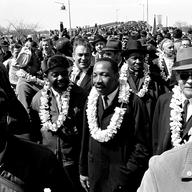  In this March 21, 1965 file photo, Martin Luther King, Jr. & his civil rights marchers cross the Edmund Pettus Bridge in Selma, Ala., heading for capitol, Montgomery, during a five day, 50 mile walk.