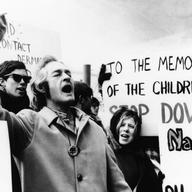 Dr. Timothy Leary, LSD advocate and champion of the “Drop Out, Cup Out, Turn On” crowd, drops in on student demonstration against Dow Chemical Co. recruiters on the Syracuse University campus.