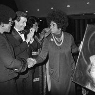 Leontyne Price, being honored by Delta Sigma Theta, a public service sorority, accepts a painting presented to her at the Metropolitan Opera House in New York on Oct. 10, 1973.