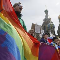 Gay rights activists shout slogans during a traditional May Day march in St.Petersburg, Russia, Friday, May 1, 2015.