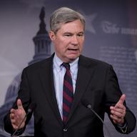 Sen. Sheldon Whitehouse, D-R.I., accompanied by Sen. Charles Schumer, D-N.Y., speaks to reporters on Capitol Hill in D.C., April 2, 2014, about the Supreme Court decision McCutcheon vs. FEC.