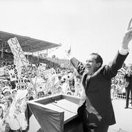 In this Sept. 19, 1968, file photo, then-presidential candidate Richard Nixon flashes the victory sign as he acknowledges cheers from the crowd, at the fairgrounds of Springfield, Mo. 