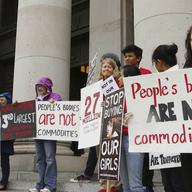 In this Oct. 21, 2014 file photo, people opposed to child sex trafficking rally outside of the Washington state Supreme Court in Olympia, Wash. The Washington Supreme Court ruled Sept. 3, 2015.