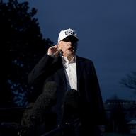 President Donald Trump tries to a hear a question from a member of the media on the South Lawn at the White House in Washington, Sunday, Dec. 17, 2017, as Trump returns from Camp David in Maryland.
