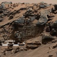 A recent image captured by Curiosity on its way up the Mt. Sharp stream bed on Mars, which provides conclusive evidence of the presence of deep bodies of water for million-year periods on Mars.