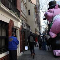 Protesters put up a inflated pig outside the home of Cablevision director Vincent Tese, claiming the company engaged in union busting. 