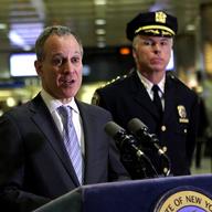 Attorney General Eric Schneiderman making an announcement at Penn Station.