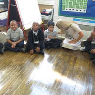 Teacher Alisyn Lima with her first grade class at Boys Prep charter school in Soundview