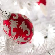 Red and White Ornament on a White Christmas Tree