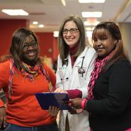 Dr. Amy Middleman with patients at the University of Oklahoma Health Sciences Center.