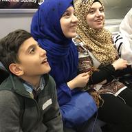 Syrian refugees on their first subway ride in New York City. 