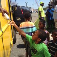 Newark kids get a free lunch as they pick up free backpacks distributed by Mayor Ras Baraka.