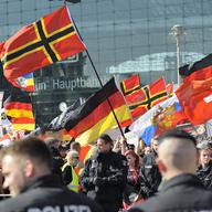  Far right-wing demonstrators gather in front of Hauptbahnhof railway station to protest against German Chancellor Angela Merkel's refugee policy on May 7, 2016 in Berlin, Germany.