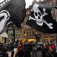 Members and supporters of anti-copyright Pirate Party take part in a rally against what they call the censorship in the Internet in Saint-Petersburg, on November 17, 2012.