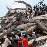 Bangladeshi volunteers and rescue workers are pictured at the scene after an eight-storey building collapsed in Savar, on the outskirts of Dhaka, on April 25, 2013.
