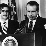Richard Nixon (1913 - 1994) gives the thumbs up after his resignation