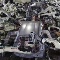 A general view shows the body welding workshop which uses automated welding machine robots that assemble automobile bodies called white body 