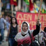 A Kurdish woman residing in Greece marches towards the Turkish embassy in Athens on July 21, 2015 to protest against the suicide bombing in the Turkish town of Suruc near the border with Syria.