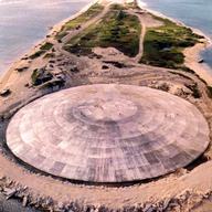 Picture taken by the US Defense Nuclear Agency in 1980, shows the huge dome, which has just been completed over top of a crater left by one of the 43 nuclear blasts on the Runit Island