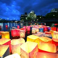 Candles and paper lanterns float on the Motoyasu River in front of the Atomic Bomb Dome at the Peace Memorial Park, in memory of the victims on the 62nd anniversary of the Hiroshima bomb. 