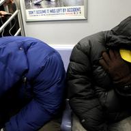 Homeless New Yorkers stay warm riding the subway as a polar vortex as the city is plunged into dangerously low temperatures.