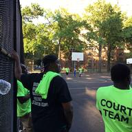 Members of the anti-violence group Man Up! at a basketball tournament for kids at the Boulevard Houses in East New York.