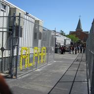 A view through the security fence of Richmond Hill High School students who attend classes in trailers, because of crowding