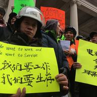 More than a hundred electric bike riding delivery men rallied at City Hall against the NYPD's plans to step up enforcement of electric bike laws in January 2018.