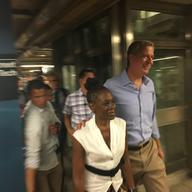 With dozens of reporters and photographers racing to keep up, Mayor de Blasio and his wife, Chirlane McCray, make their way from the F train to a campaign event.
