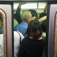 Subway doors close on crowded train at West 4th St.