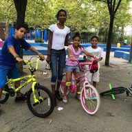 From L-R, Devin Johnson, 9, and his mother, Diane Crawford, 40, her niece A'Nia Crawford, 9, and nephew Luis Martinez, 11, enjoying the last week of summer in the South Bronx.