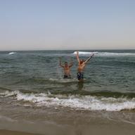 Steve Zemann and Michael Barich take a dip in the ocean at the municipal beach in Sea Bright, NJ. coastcheck