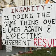 A protest sign that was hanging on a fence at the Occupy Auckland Protest camp. 2011