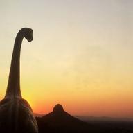 Jorge Saenz uses a small herd of plastic dinosaurs to enhance his travel photos
