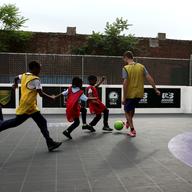 A scrimmage in East New York, led by the coaches at Street Soccer USA.