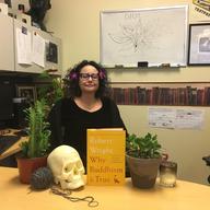 Brooke Gladstone meditates in her office.