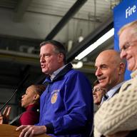 Mayor Bill de Blasio briefs the press on snow storm clean-up efforts with FDNY chief Salvatore Cassano (c) and Dept. of Sanitation head John Doherty (R).