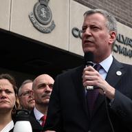 Mayor Bill de Blasio, City Council Speaker Melissa Mark-Viverito and Fire Commissioner Sal Cassano outside of a Salvation Army relief center in Harlem.
