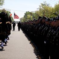 Thousands of officers from around the country lined the streets of Seaford, Long Island for the funeral of 25-year-old NYPD officer Brian Moore's funeral.