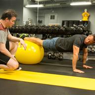 Kevin Corrigan and Guy Pearce in RESULTS, a Magnolia Pictures release. Photo courtesy of Magnolia Pictures.